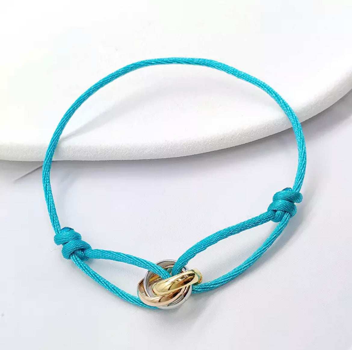 Trinity armband azul